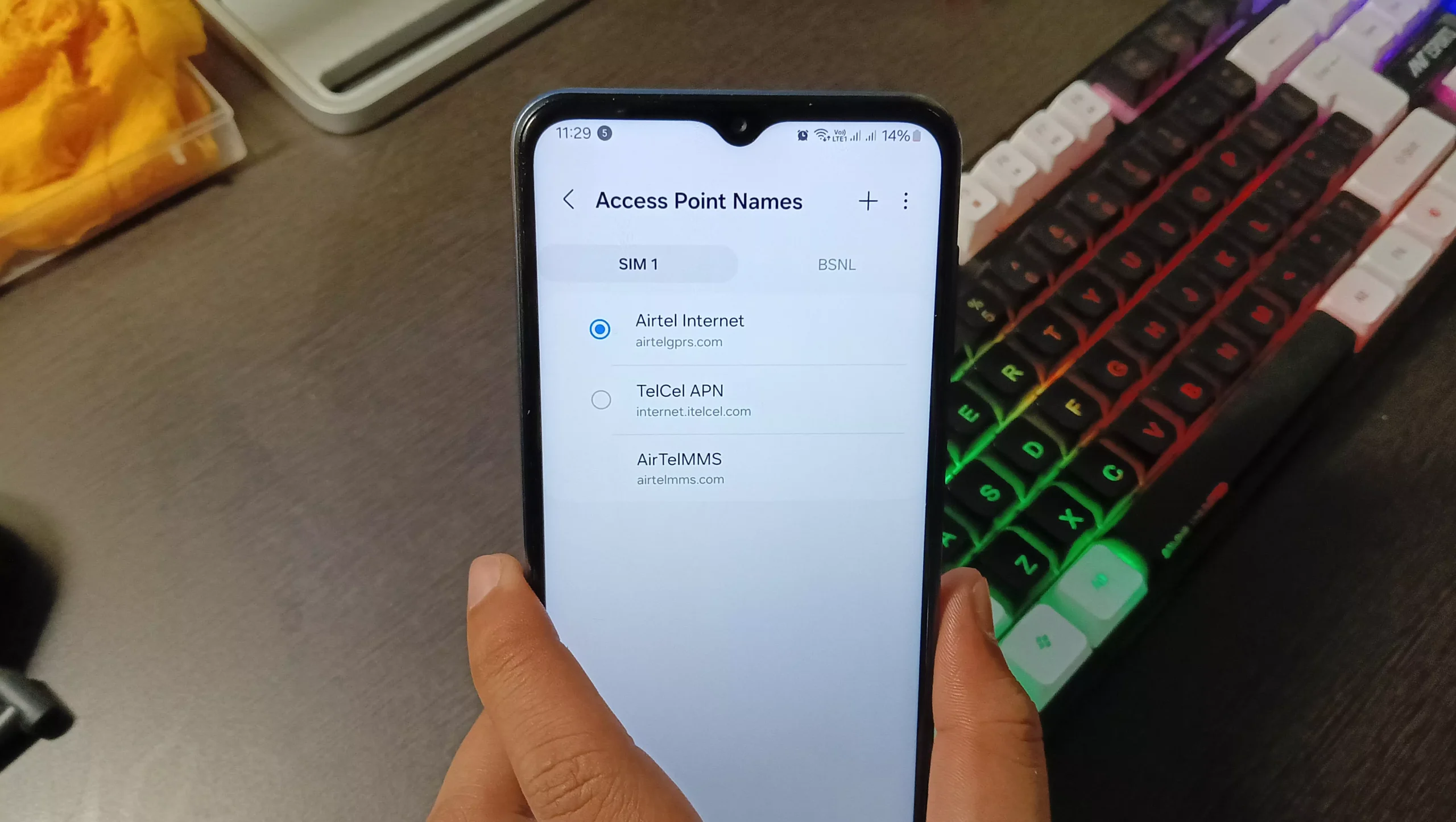image of holding the phone with android access point name menu with telcel and airtel apn